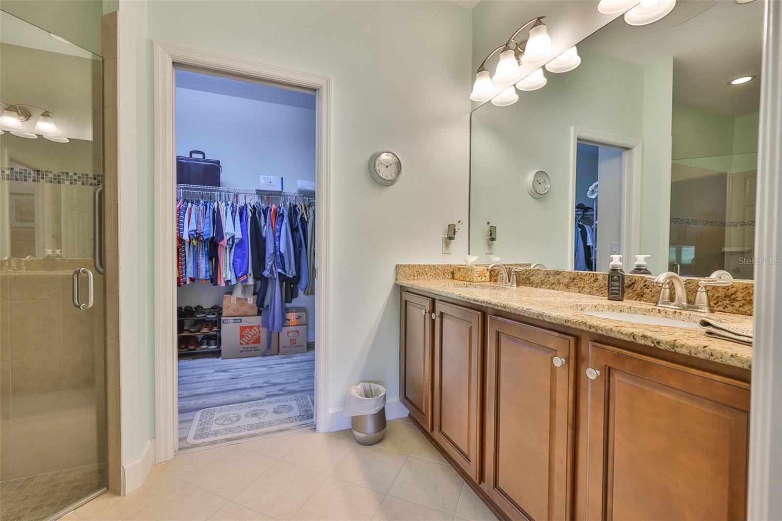 Primary Bath, dual under-mount sinks, stainless faucets, granite counter, private water closet
