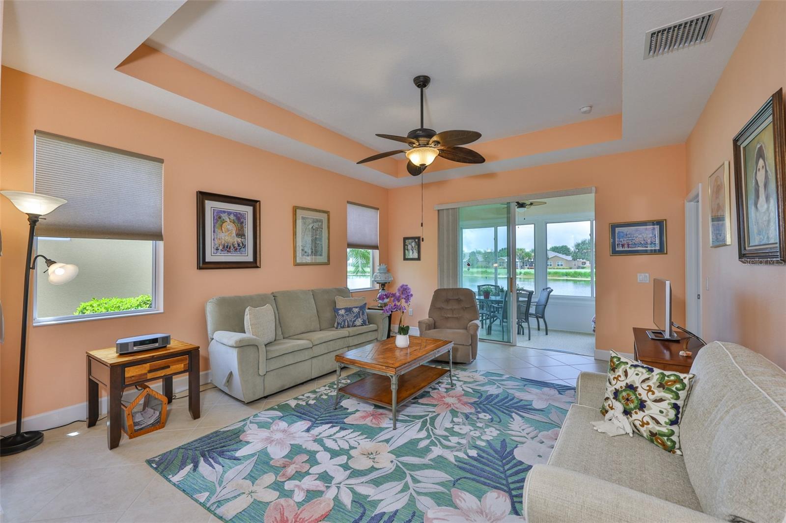 Great Room with ceiling fan and tray ceiling, Florida Room and water!