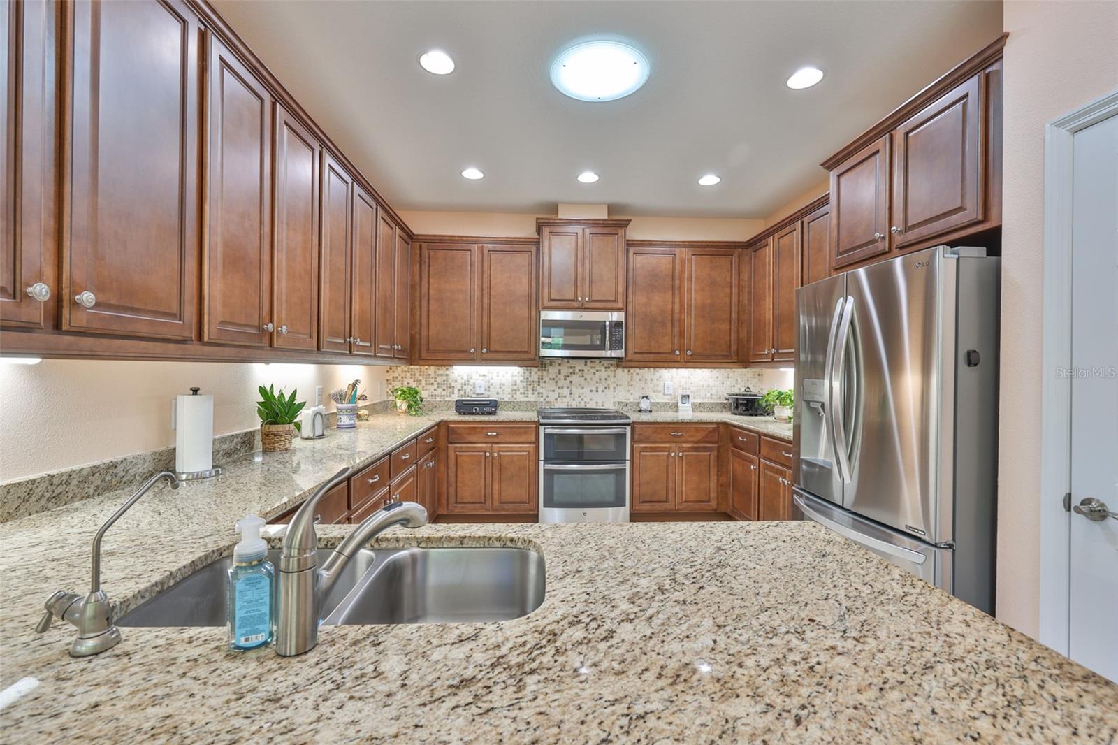Chef's Kitchen with 42" cabinets, crown molding and solar tube light with night retention