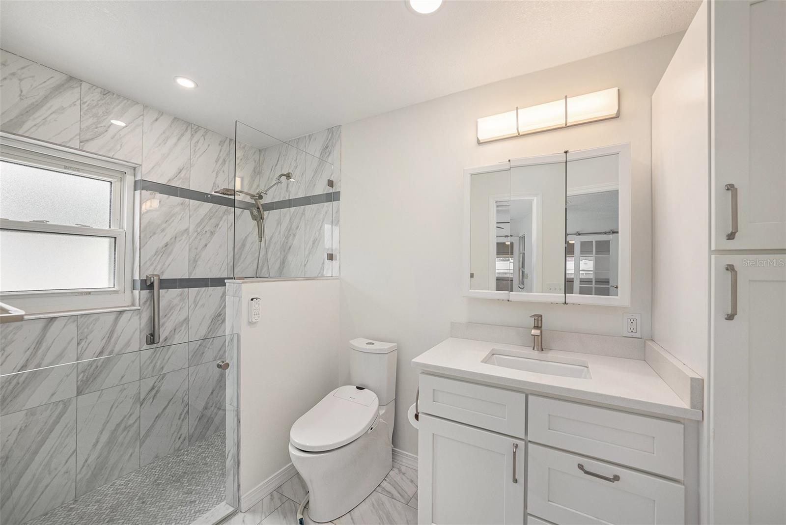 Remodeled bath features step in shower & so much more!