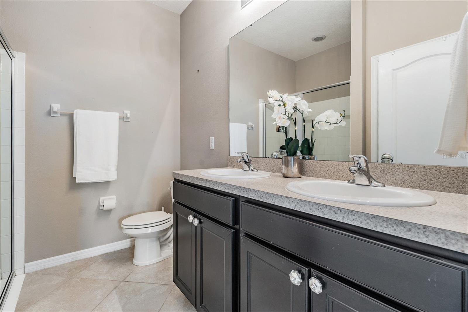 Primary Bathroom with walk in shower dual sinks