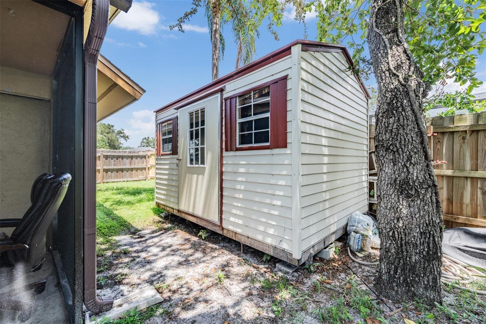 Storage shed in back stays!