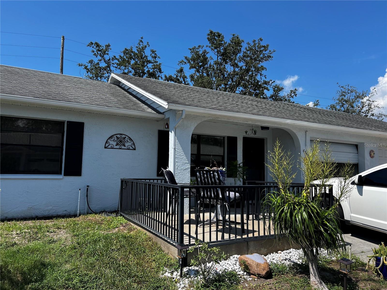 Closer View of Front of Villa and fenced patio