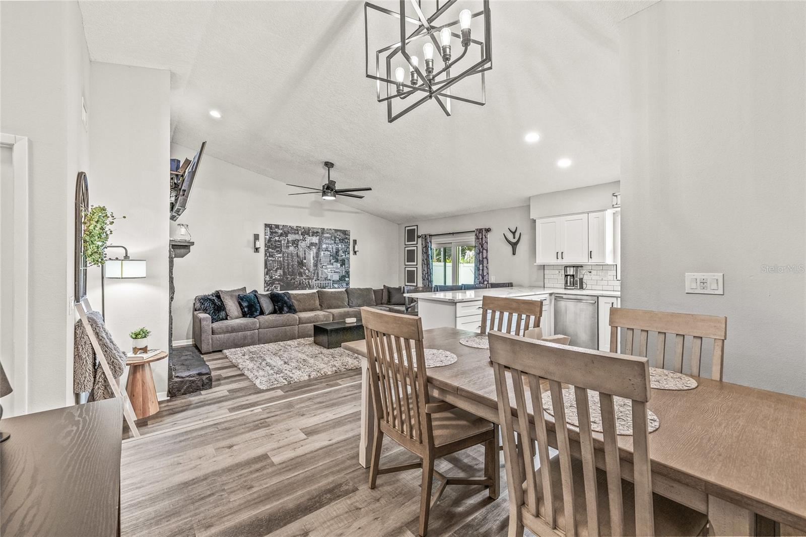 View of kitchen and dining from living room