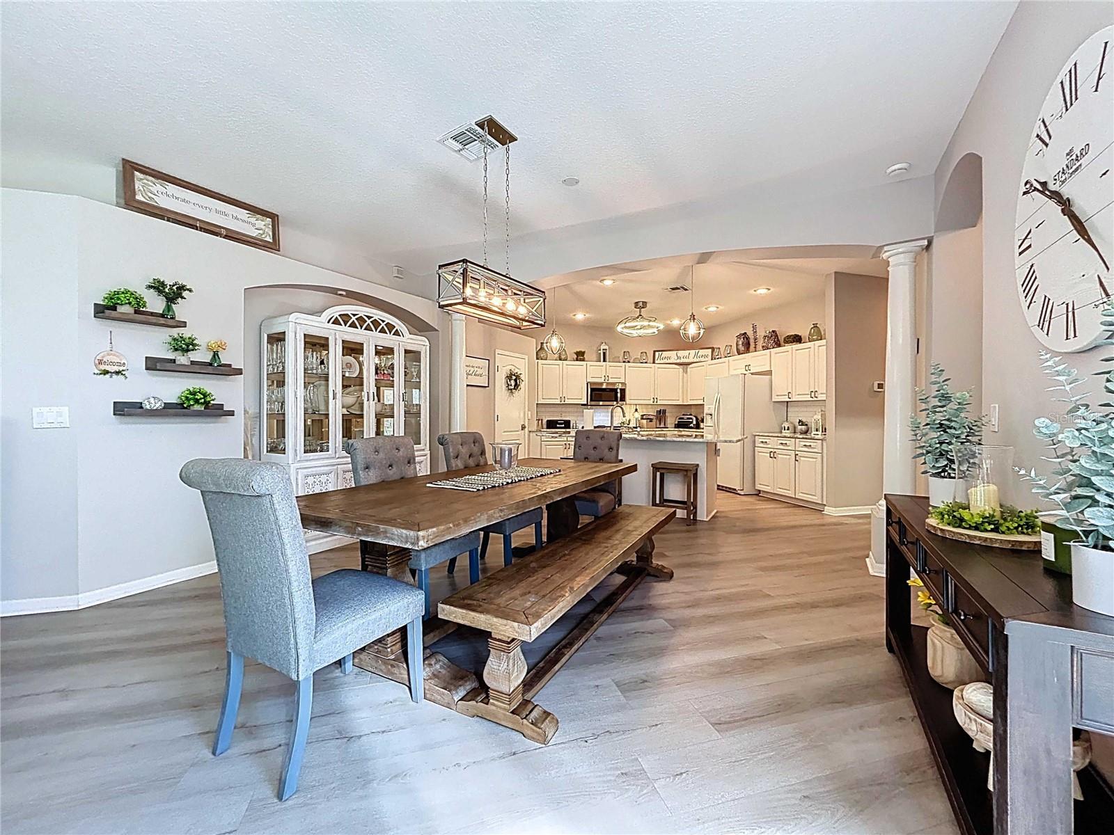 Dining room with LVP featuring LVP flooring