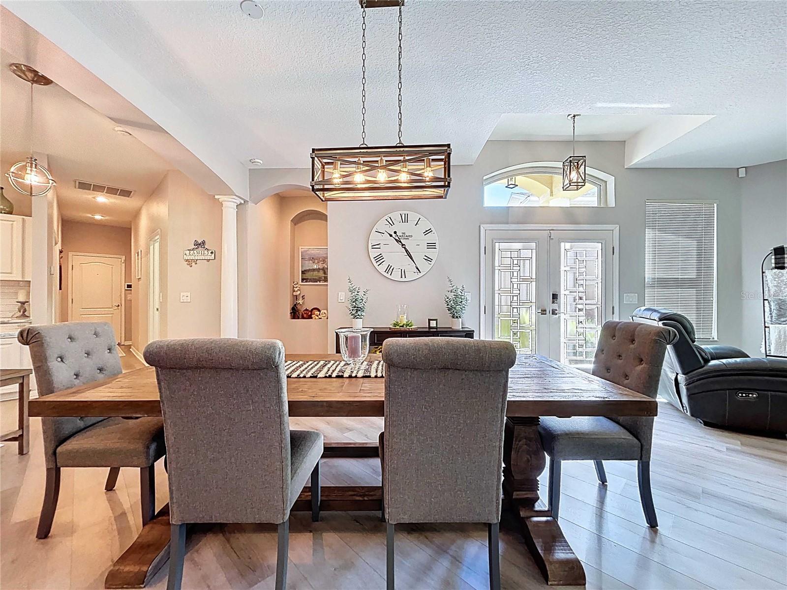Dining room featuring updated lighting