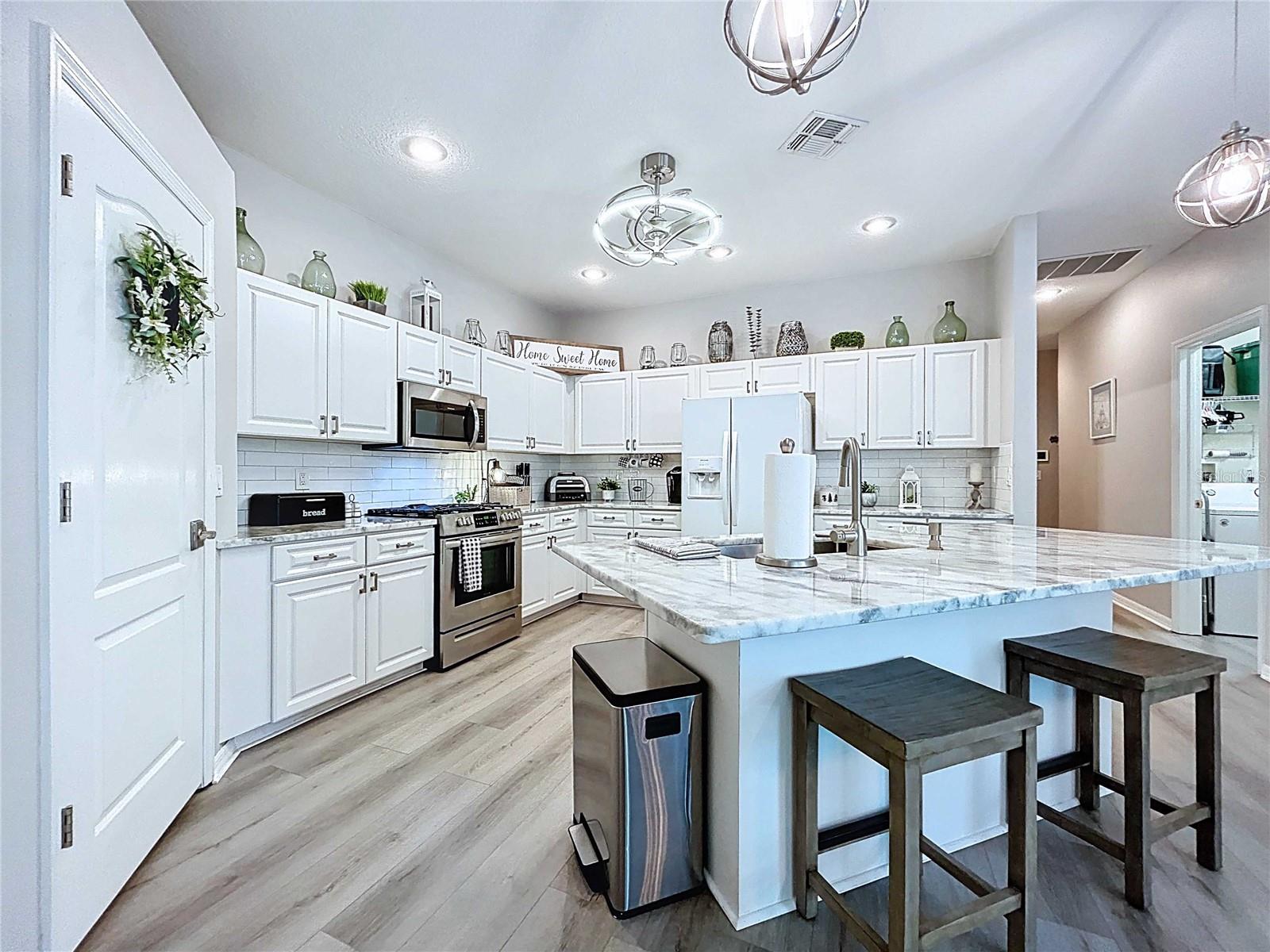 Modern LED brushed nickel fan in kitchen