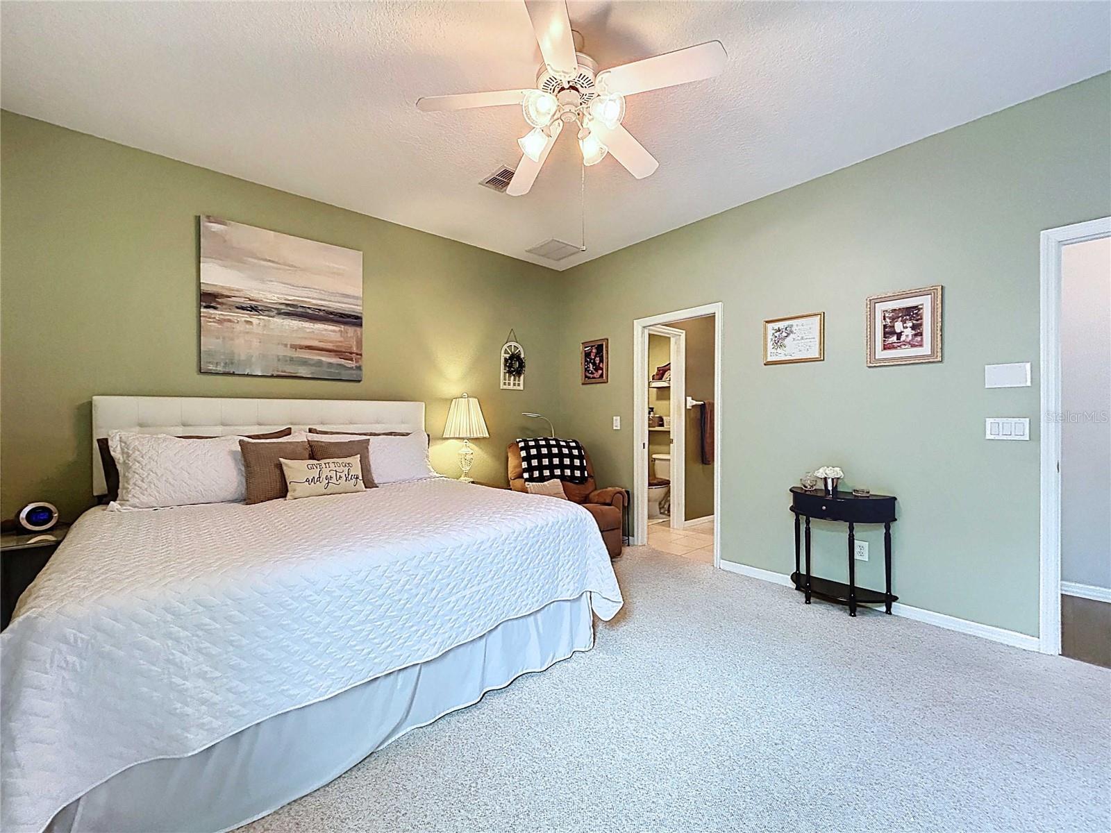 Primary bedroom with berber carpet