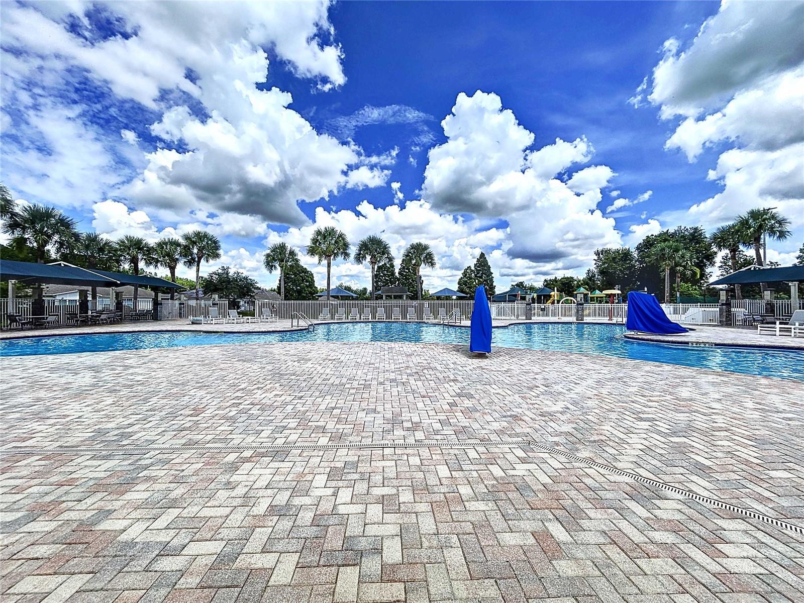 Amenity center pool with cabanas & chairs