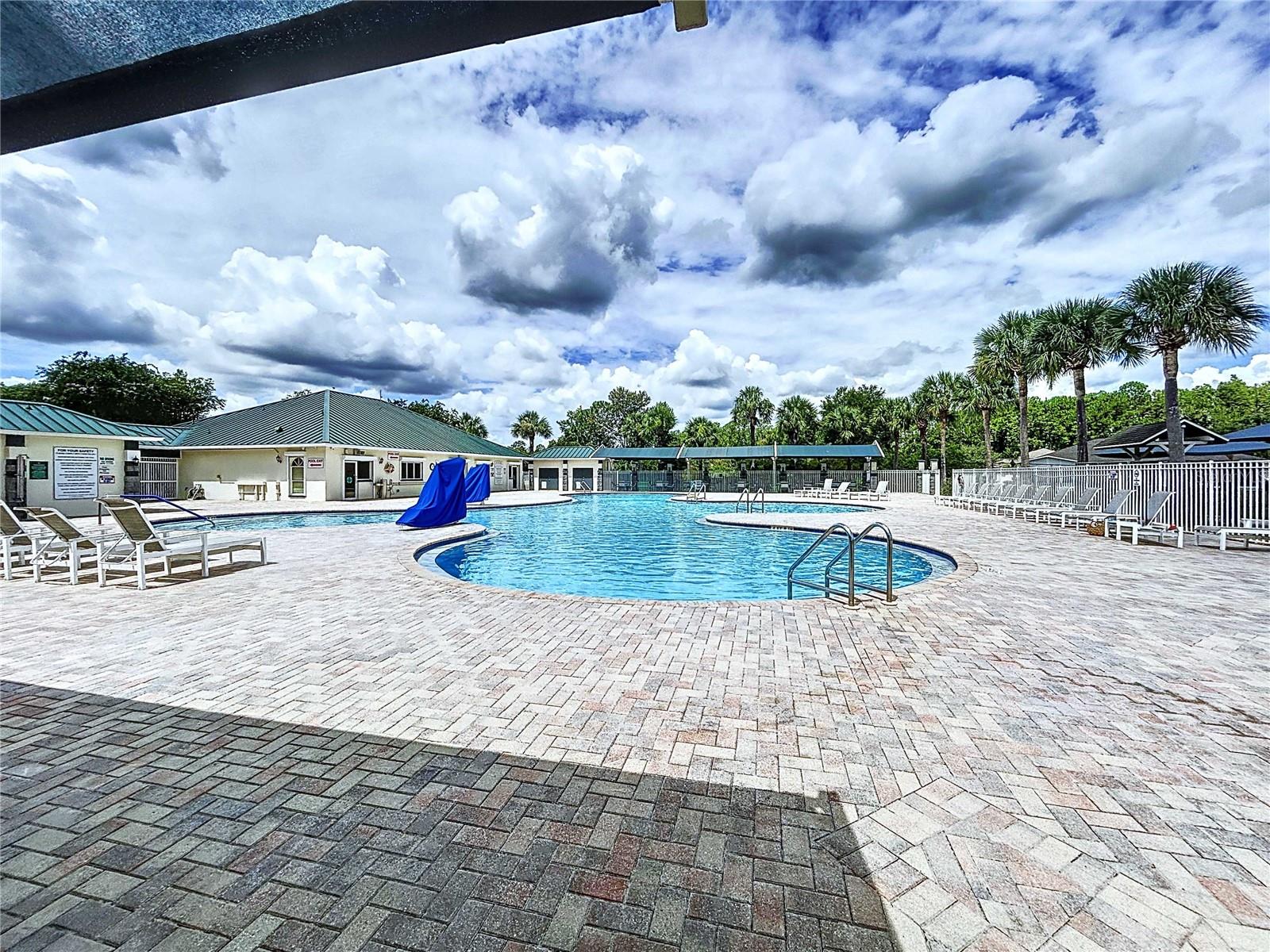 Amenity center pool with cabanas & chair