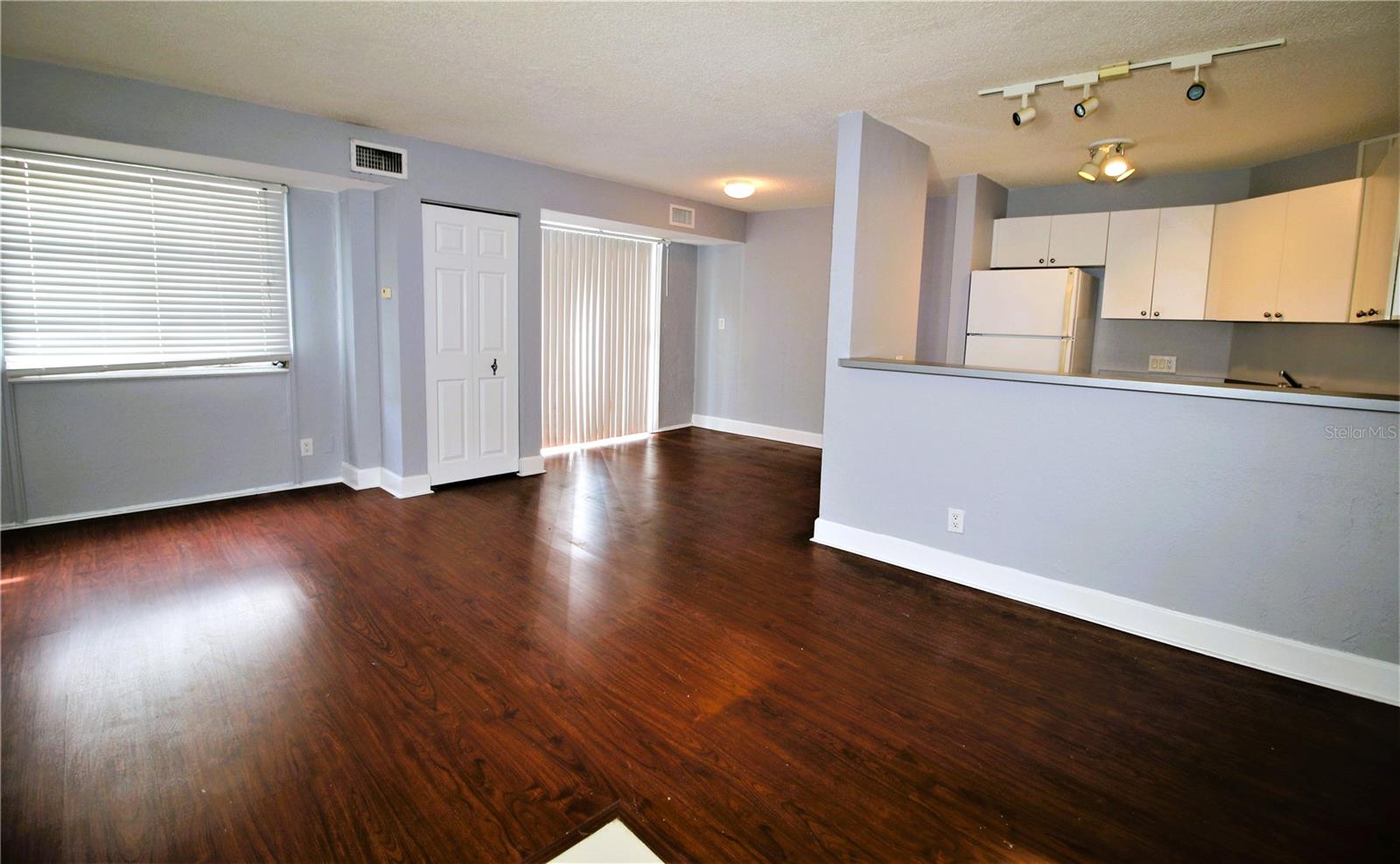 Living room with dining area and kitchen on the right