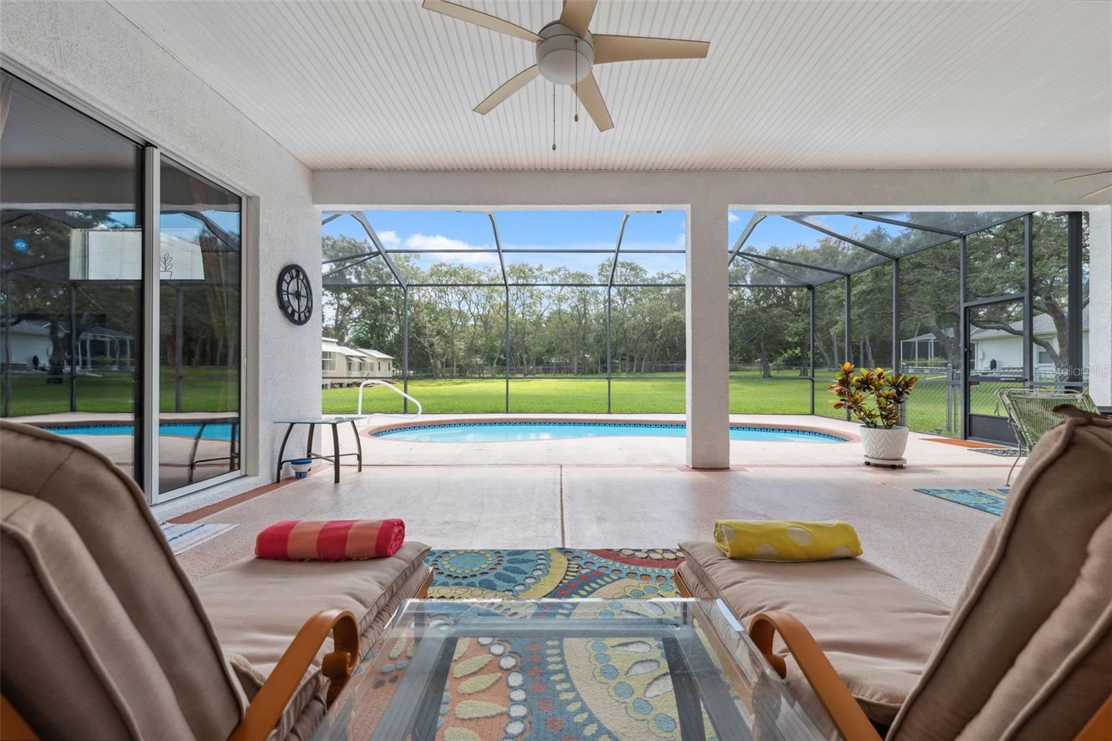 Wonderful screened in pool and patio area.