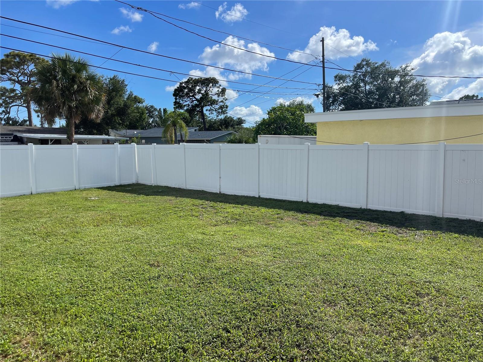 NEW VINYL FENCED - IN BACK YARD