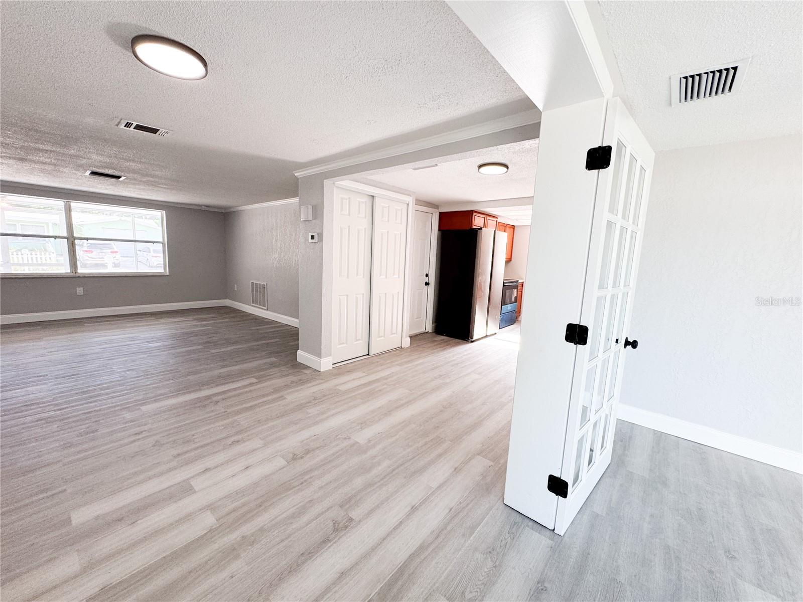 Looking toward dining and living area from 4th bedroom/family room/den.