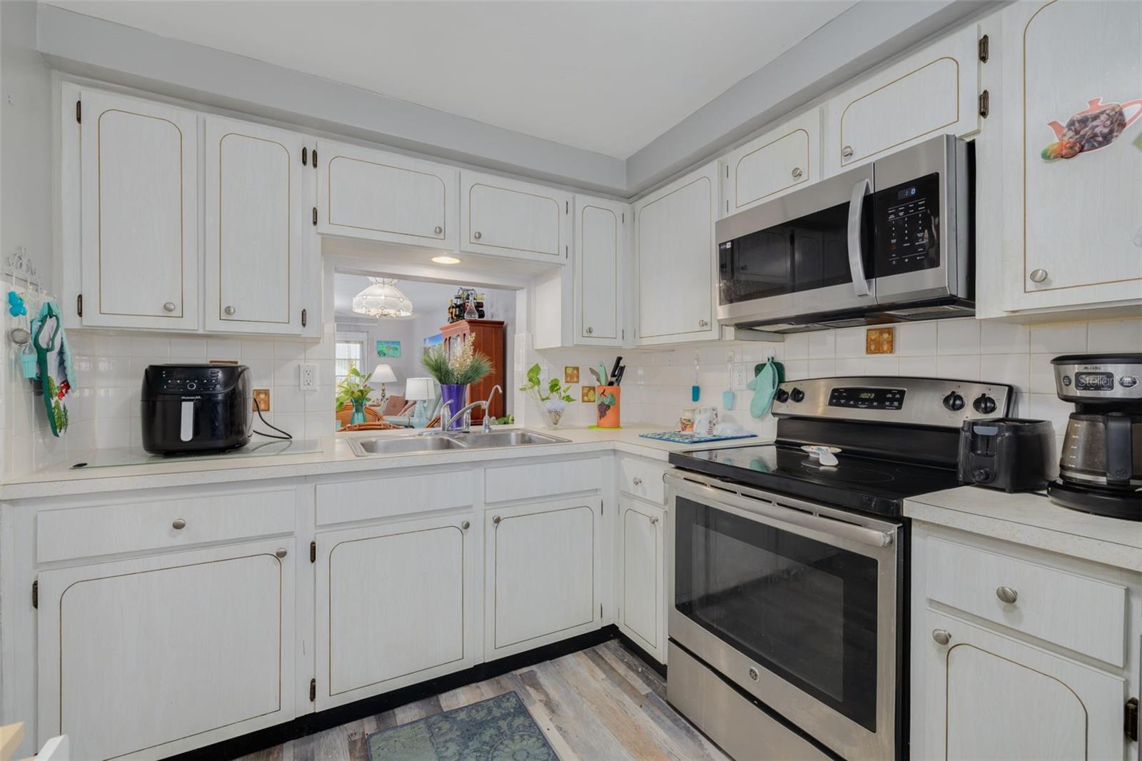 Kitchen with abundant white cabinetry.
