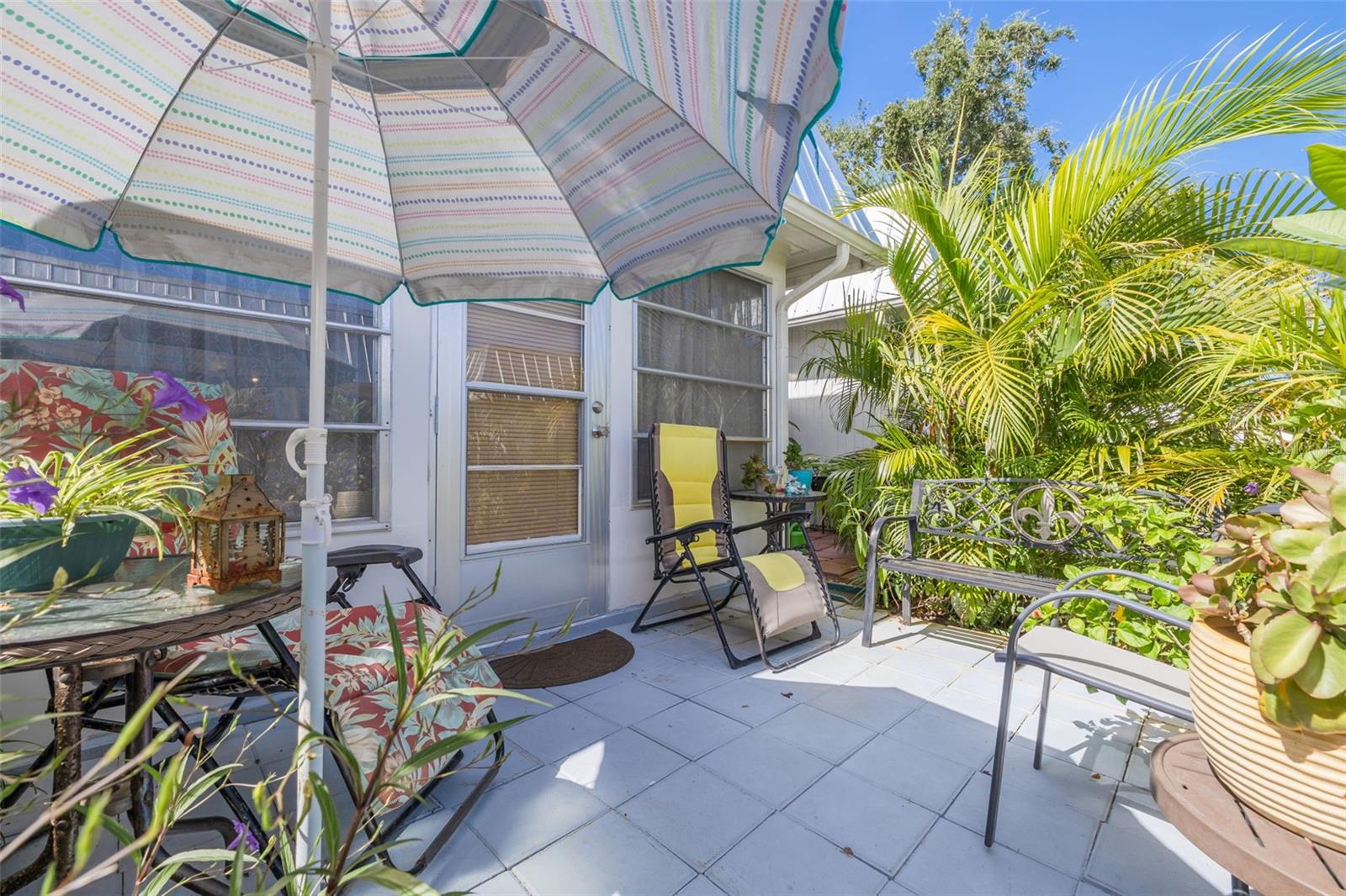 Private Outdoor Patio adorned with Plants and Flowers!