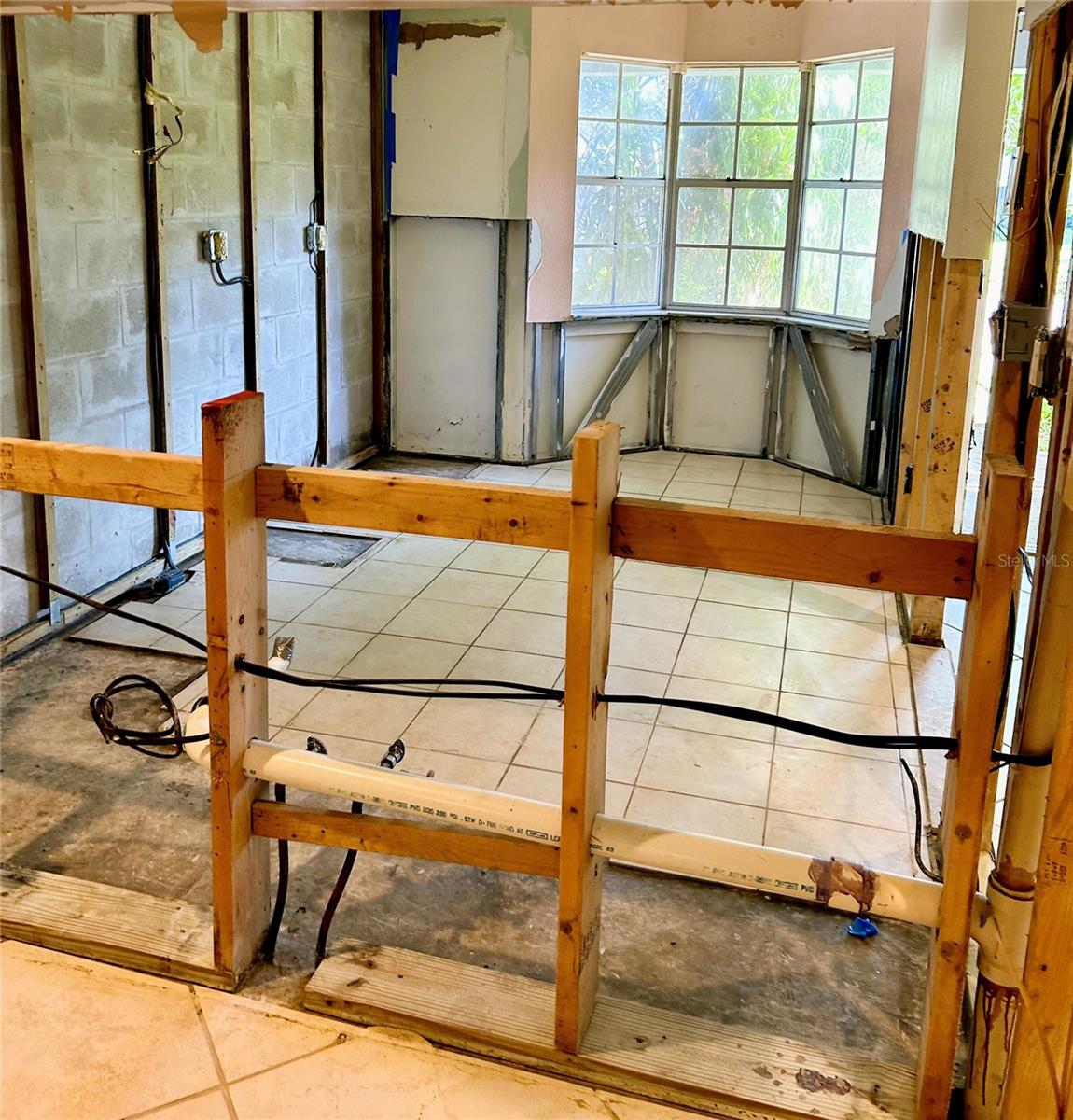 Kitchen needs rehab due to pipe leak.  Block construction.