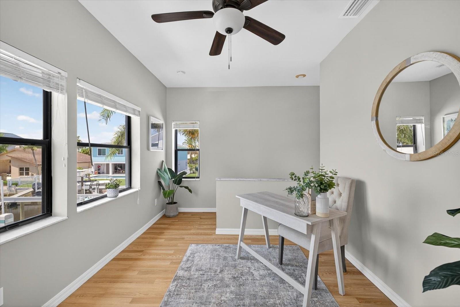 Upper level bonus room makes perfect home office, yoga or sitting room