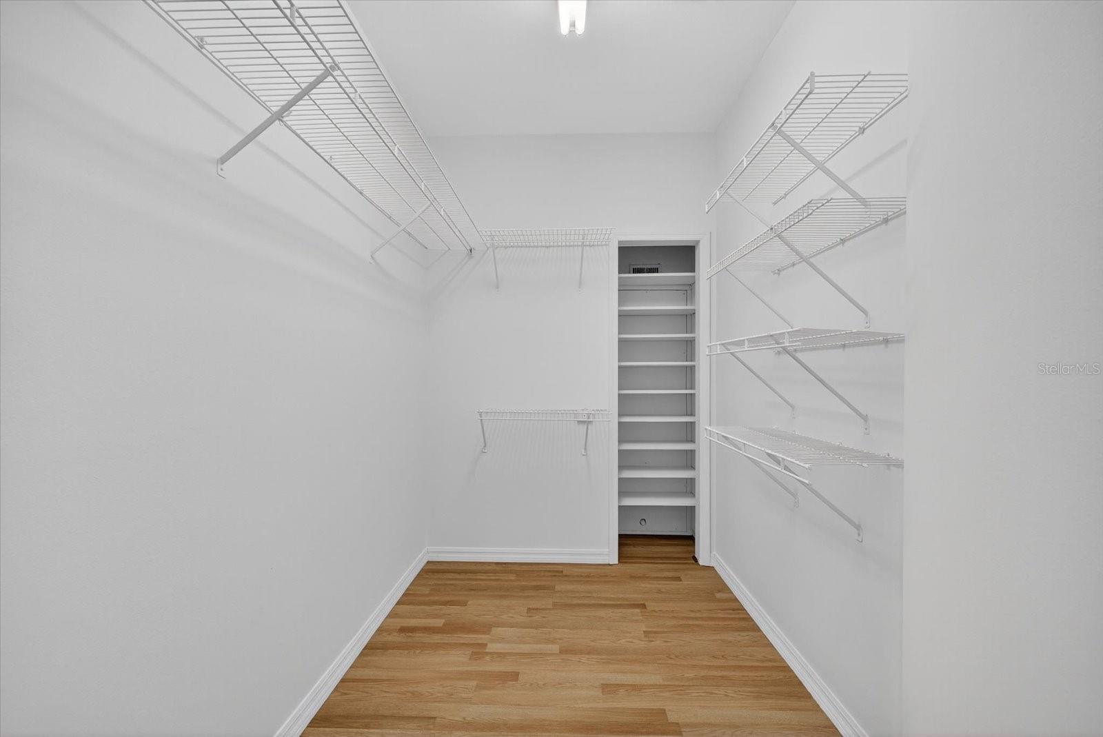 Upper level primary walk-in closet