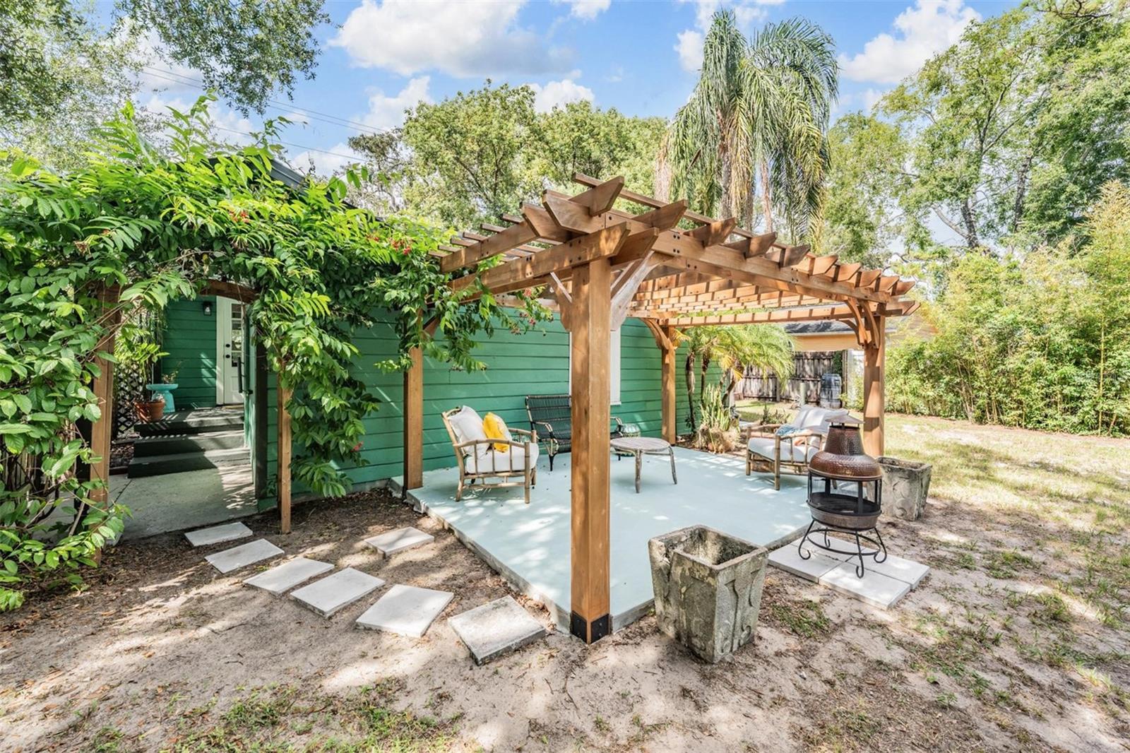Backyard pergola,  more storage and laundry room behind pergola