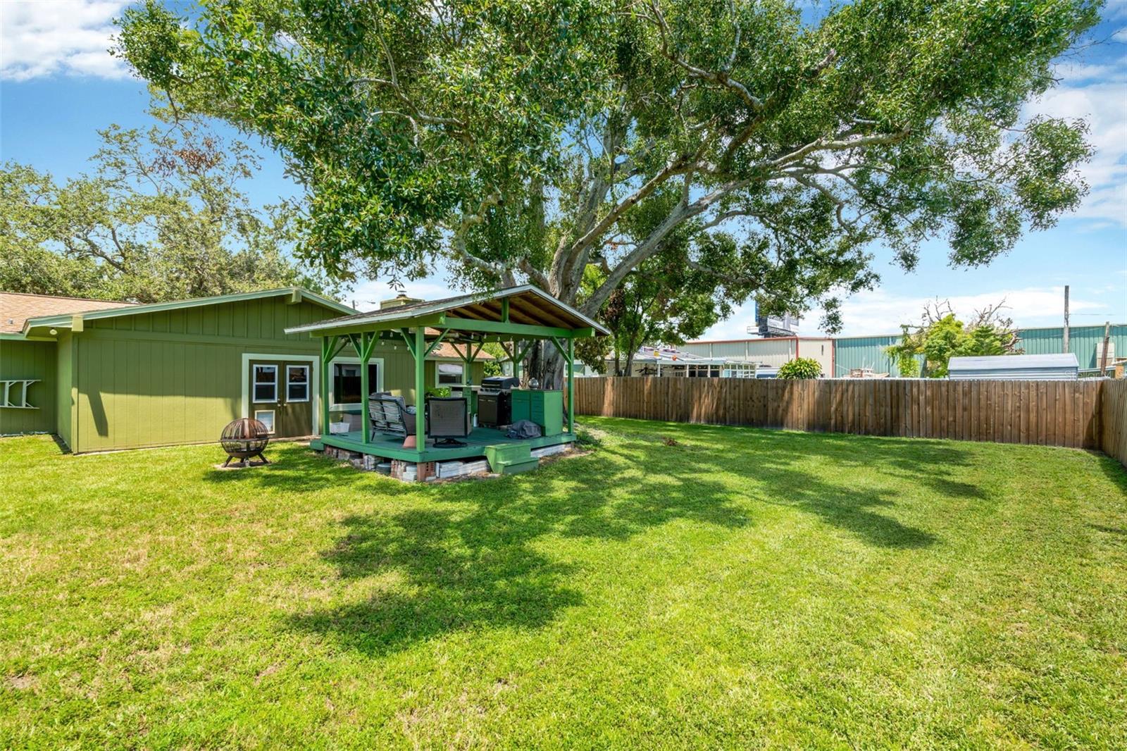 Backyard with covered deck.