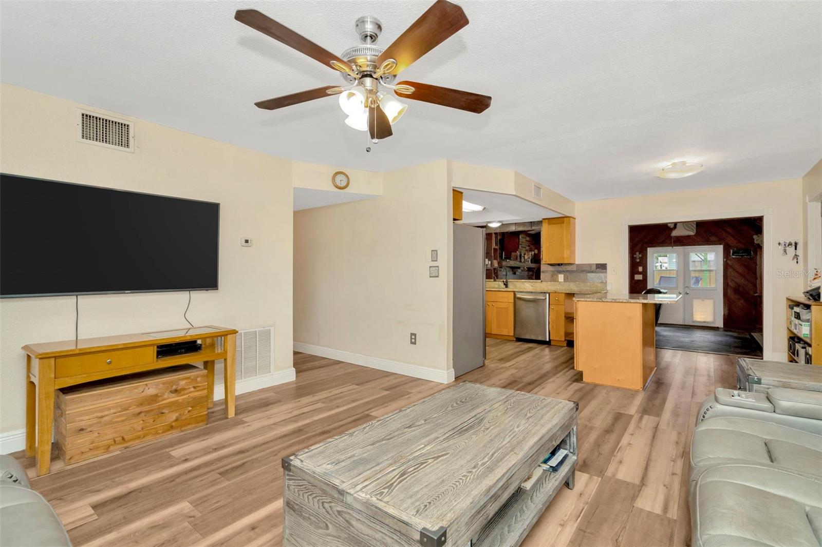 Living room facing kitchen and hallway.