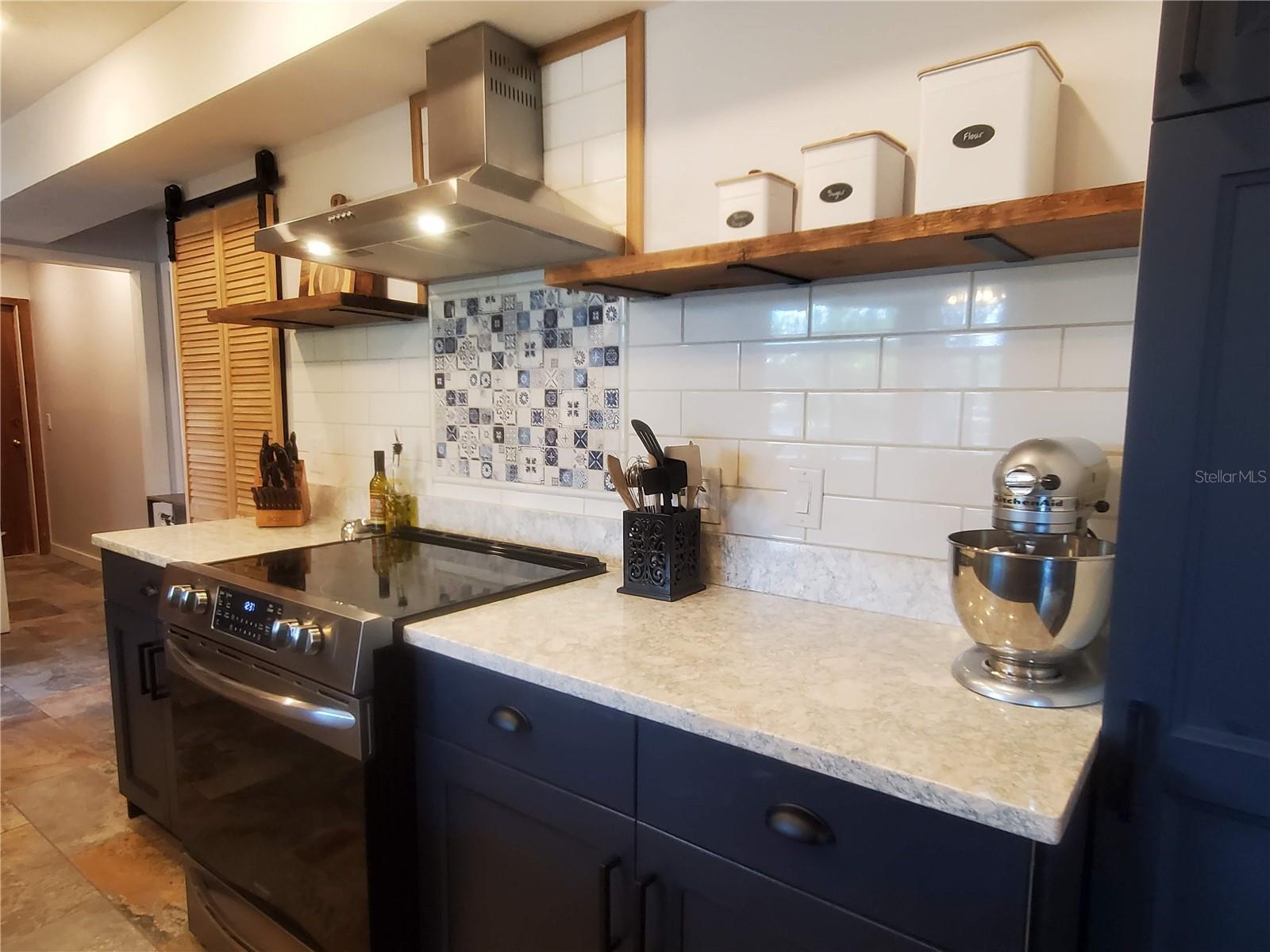 Quartz counters! Tile backsplash.