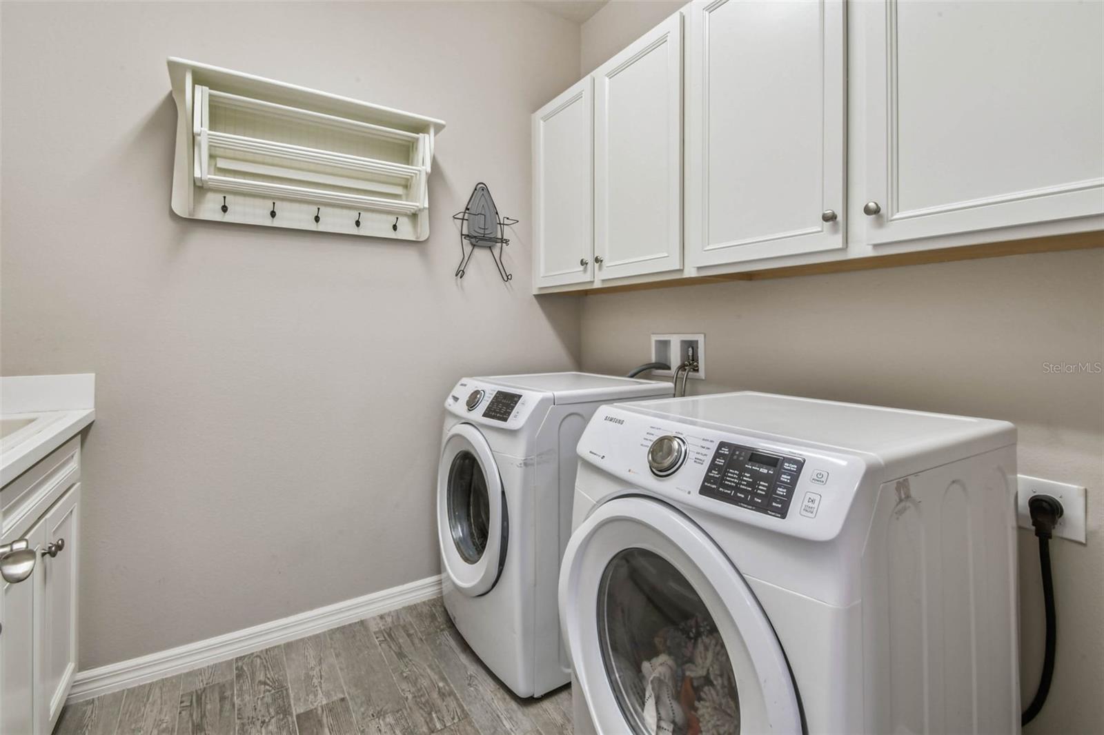 First Floor Laundry Room with plenty of storage and wash sink