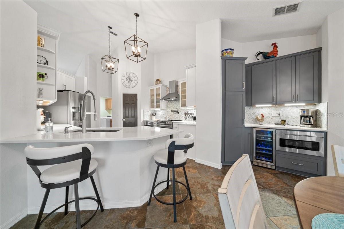 Entertaining bar with under-counter wine refrigerator