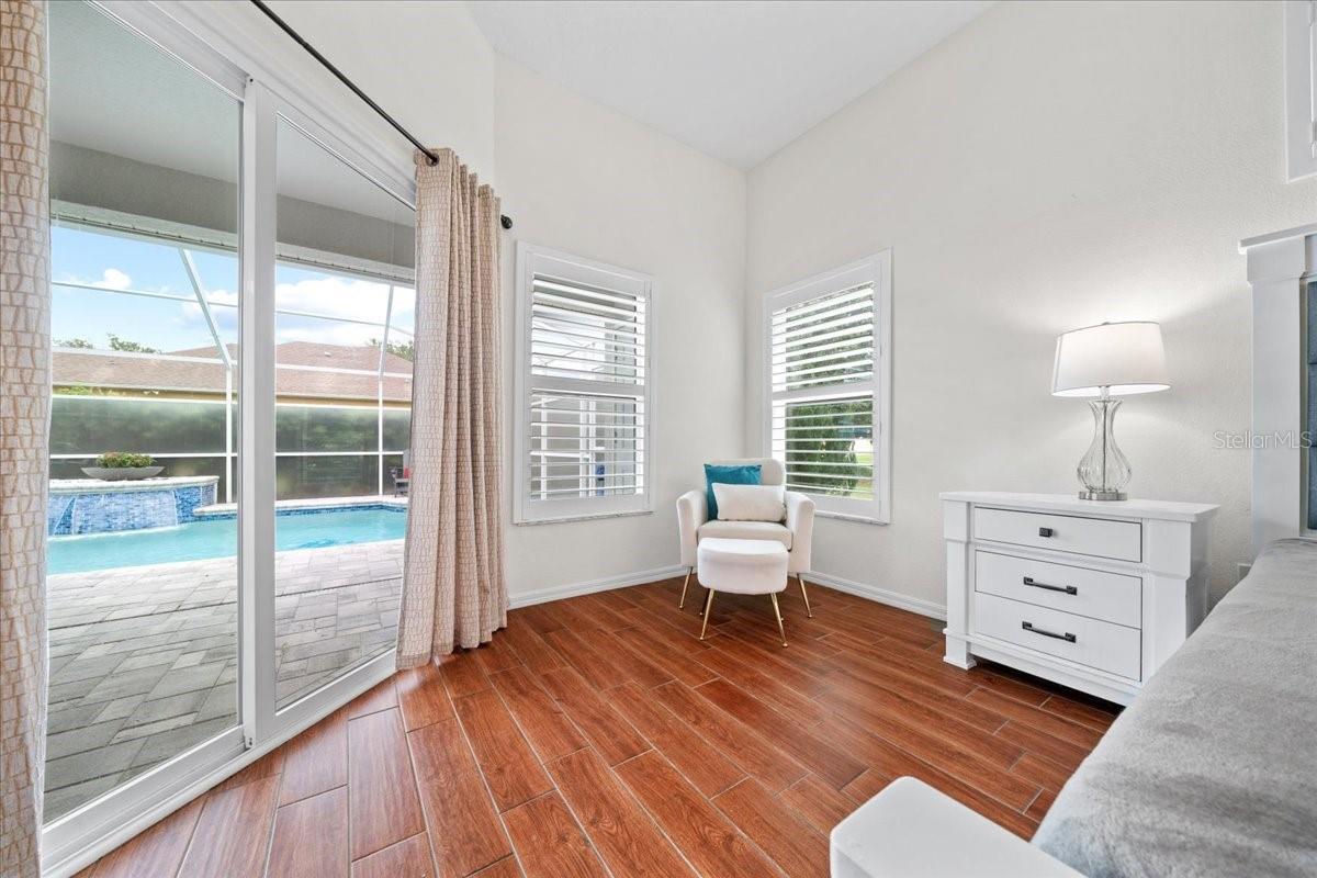 Expansive primary suite with calm, neutral finishes