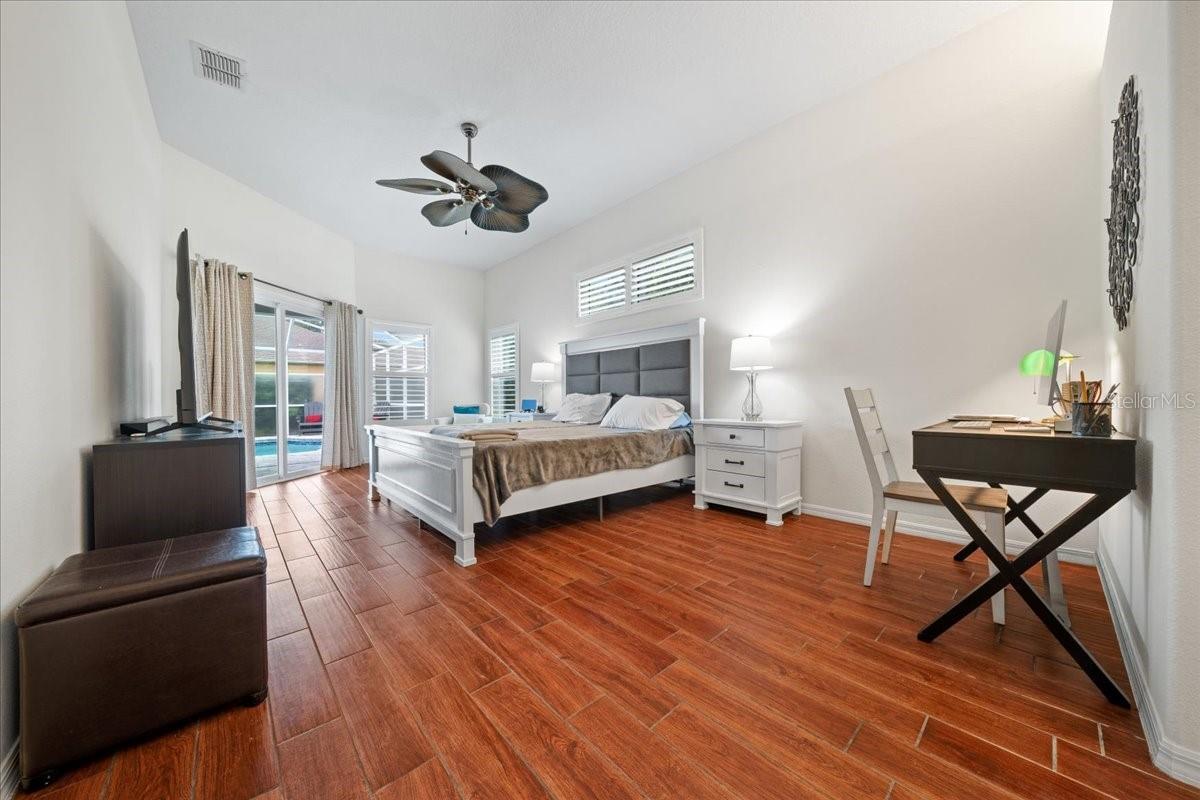 Expansive primary suite with calm, neutral finishes