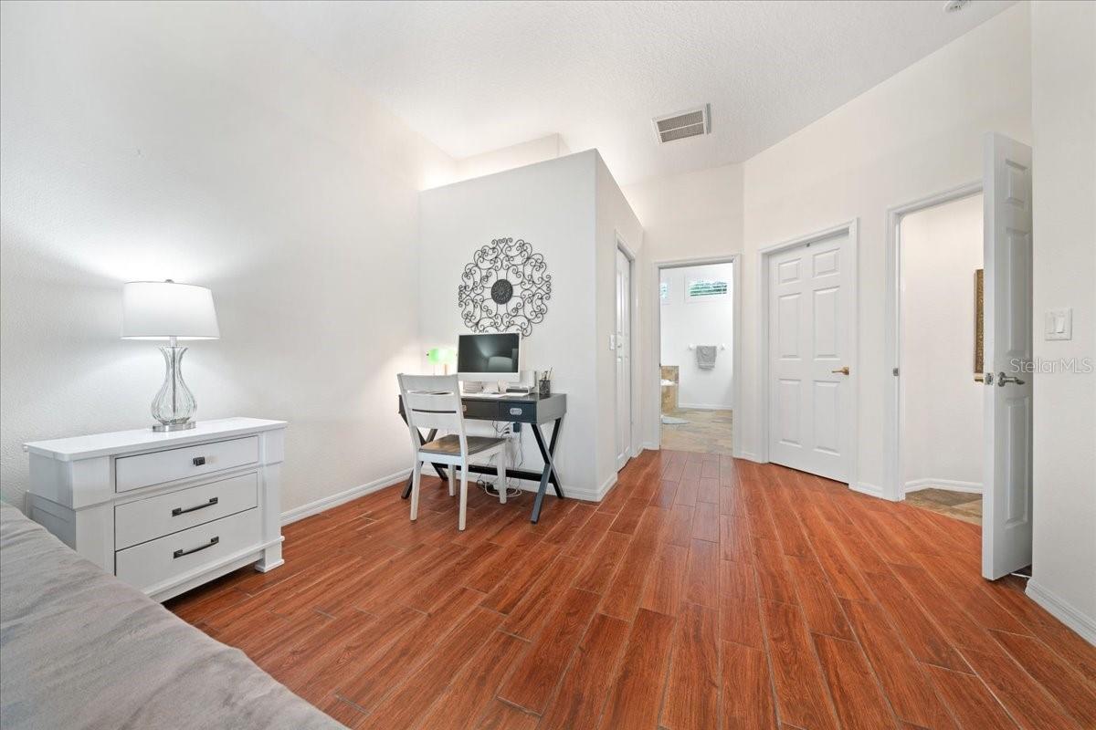 Expansive primary suite with calm, neutral finishes