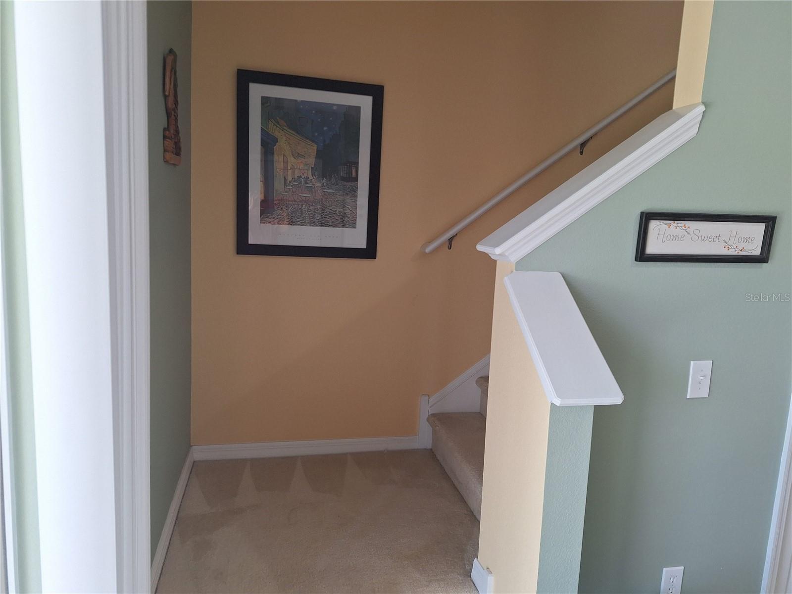 Stairs are off of the Kitchen and out of the way