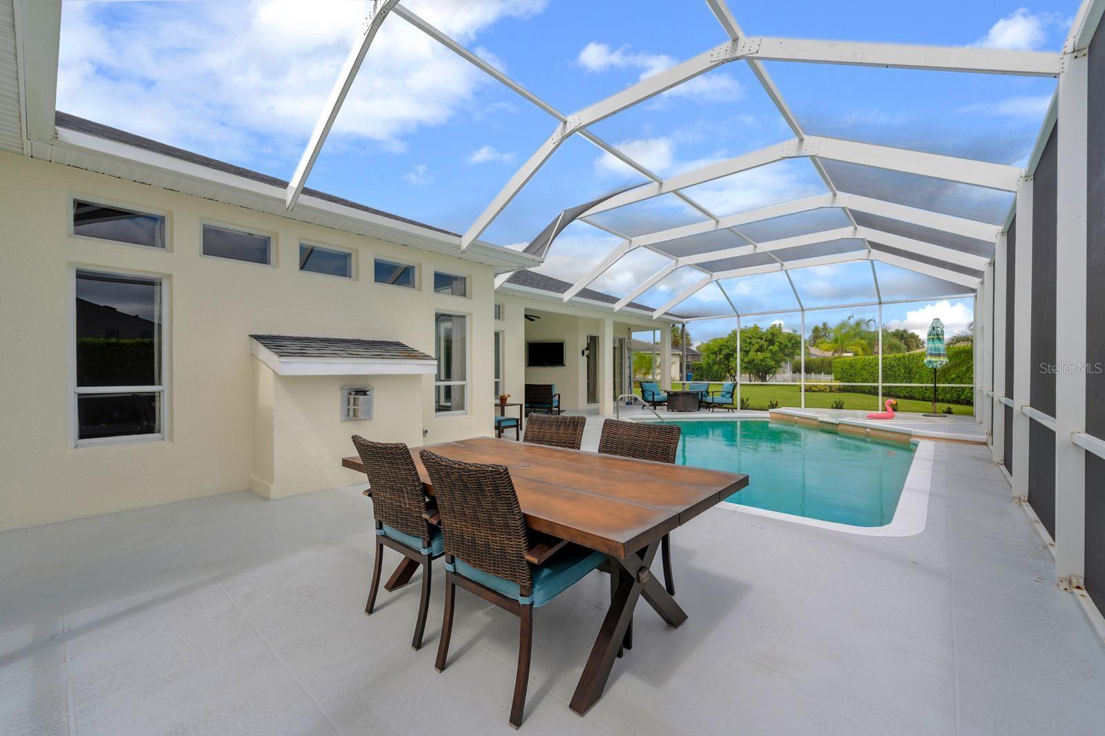The opposite side of the patio has a lot of space for lounge chairs, a grilling area, or even an outdoor kitchen
