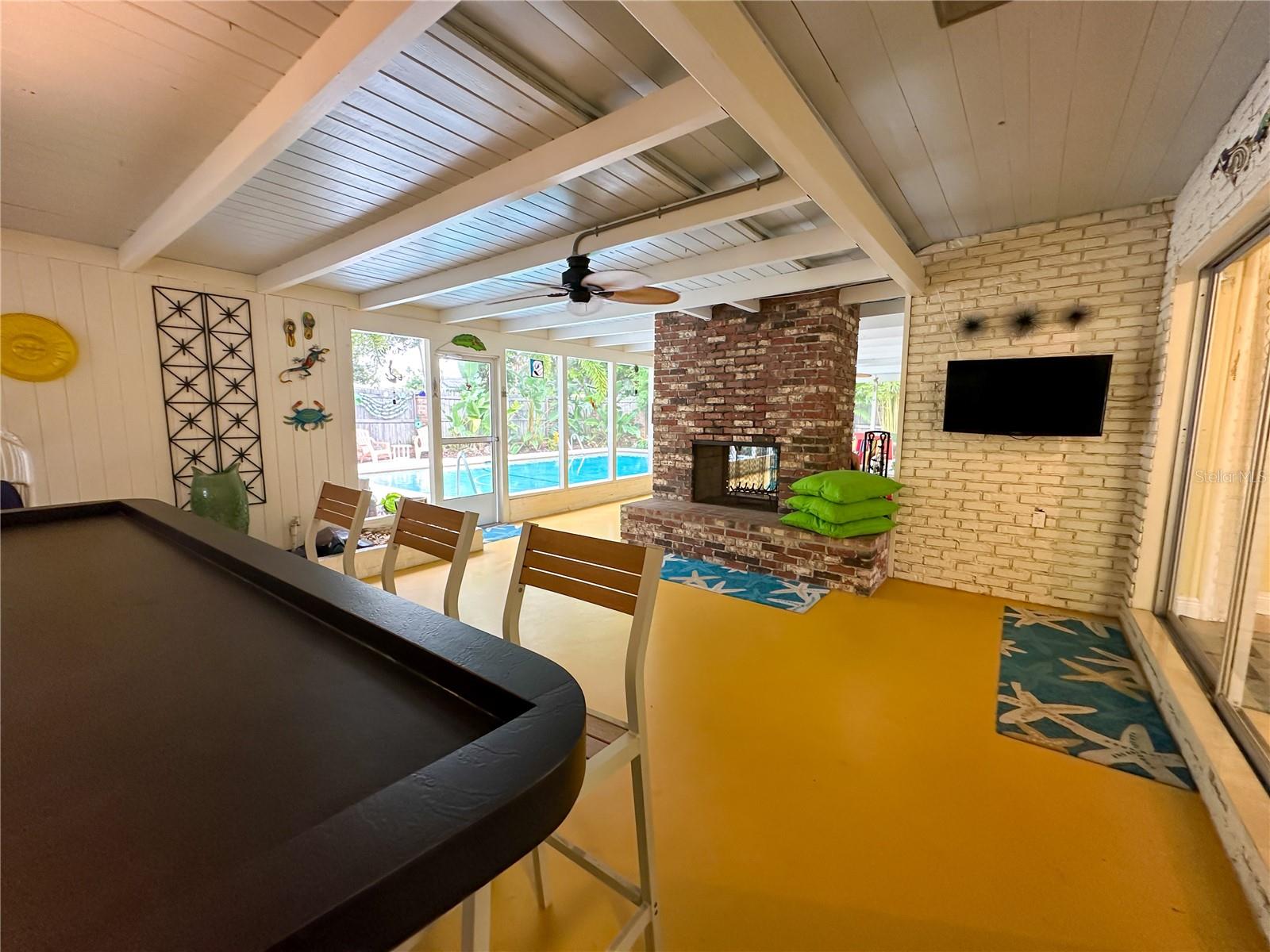 Back patio oasis with fireplace & bar