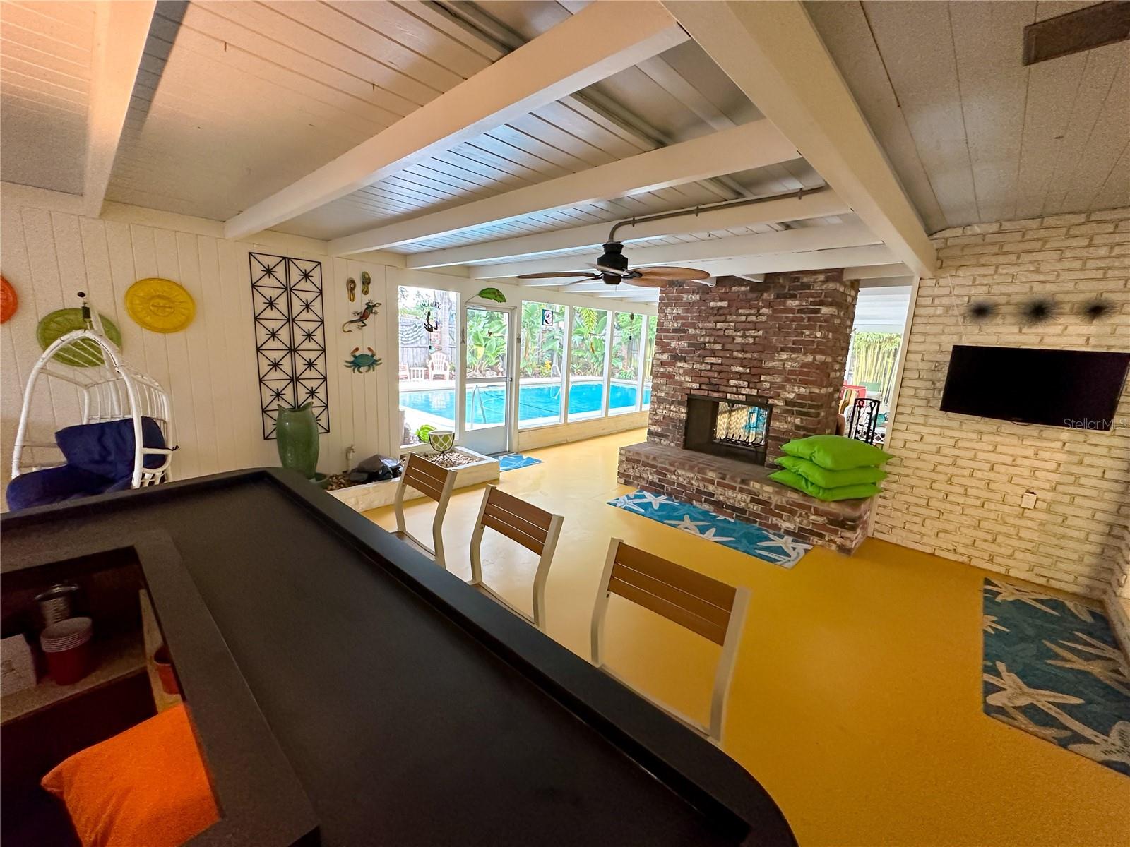 Back patio oasis with fireplace & bar