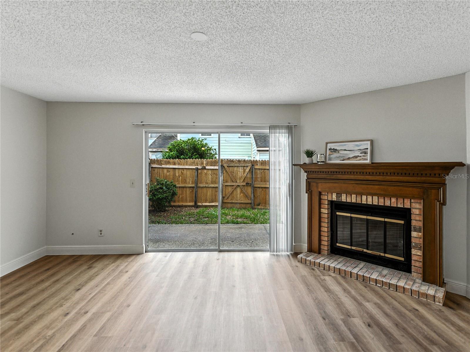 Living Room with Wood Burning Fireplace