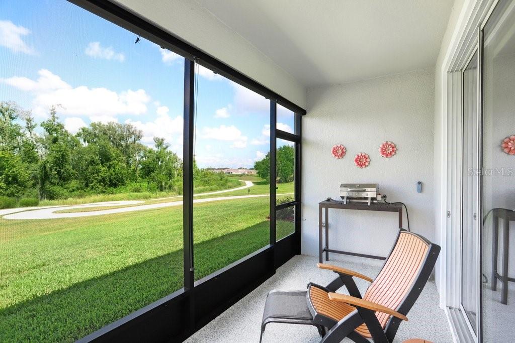 Screened Back Patio with Epoxy Floor and Sunshades
