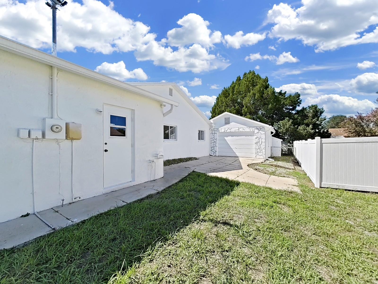 Right Side yard showing front of detached garage