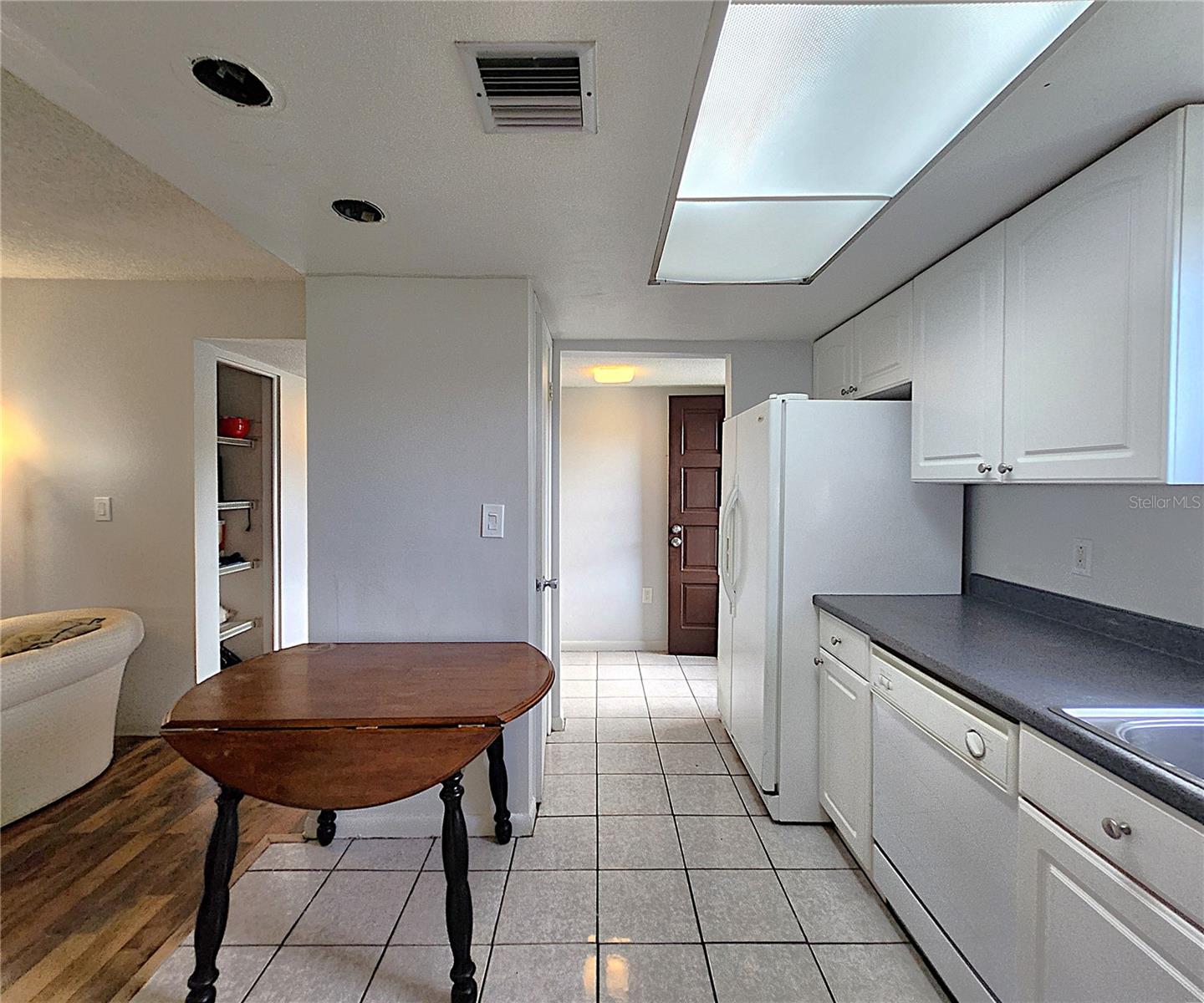 All kitchen appliances included: hooded vent, electric stove, dishwasher, refrigerator