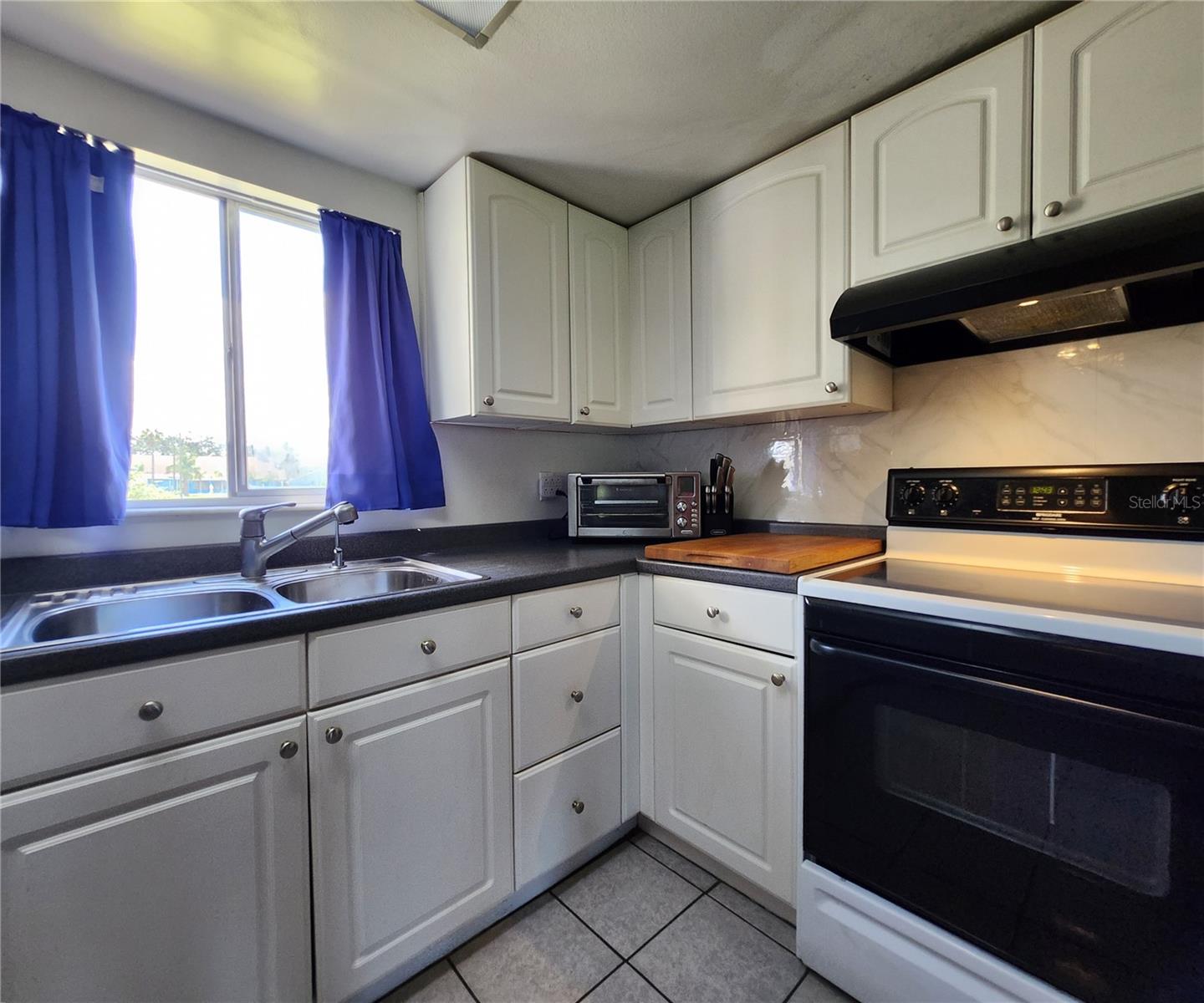 All kitchen appliances included: hooded vent, electric stove, dishwasher, refrigerator