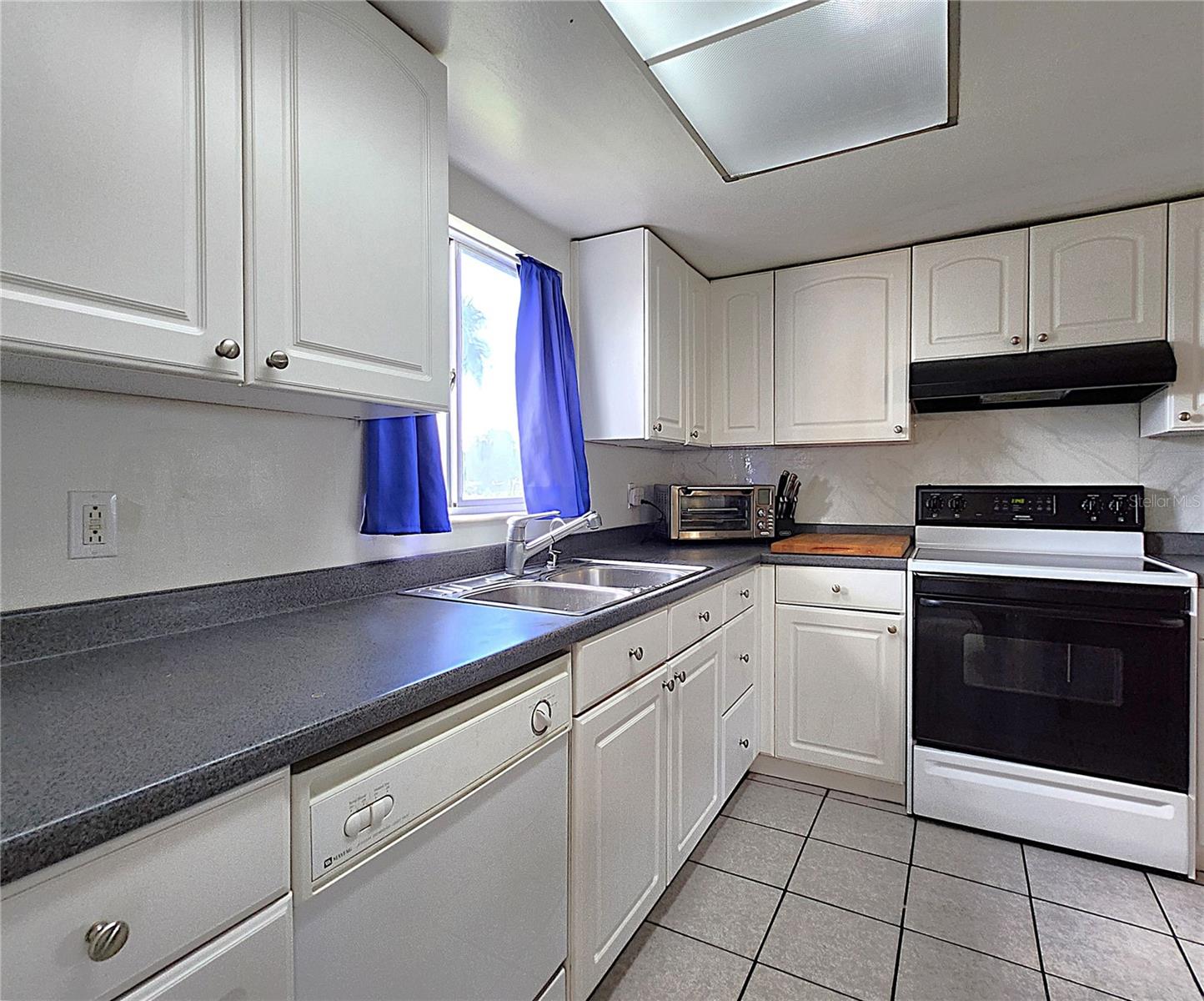All kitchen appliances included: hooded vent, electric stove, dishwasher, refrigerator