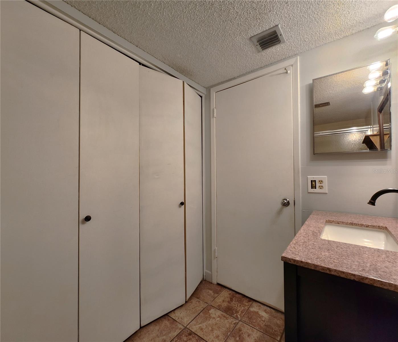 Gues Bathroom includes a Tub and Shower. Also houses the Laundry Closet w/Washer & Dryer set