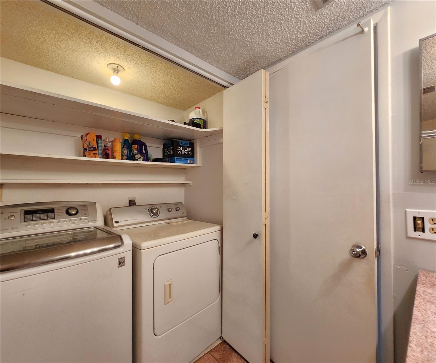 Gues Bathroom includes a Tub and Shower. Also houses the Laundry Closet w/Washer & Dryer set