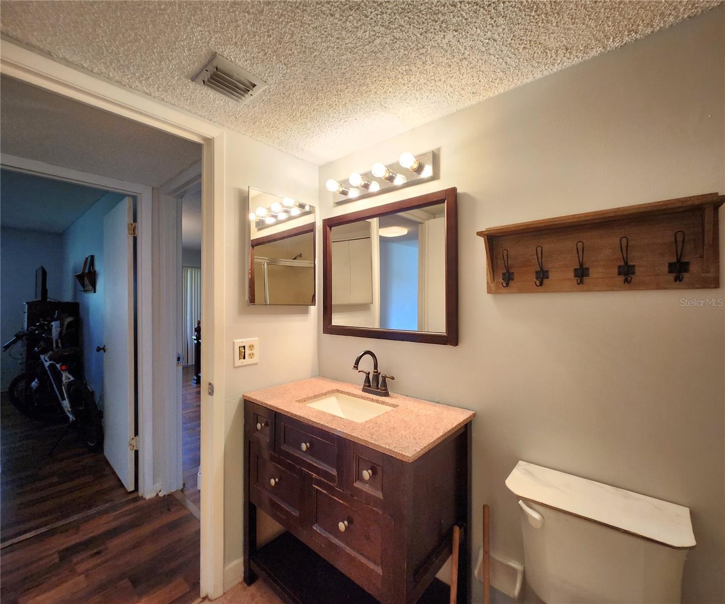 Gues Bathroom includes a Tub and Shower. Also houses the Laundry Closet w/Washer & Dryer set