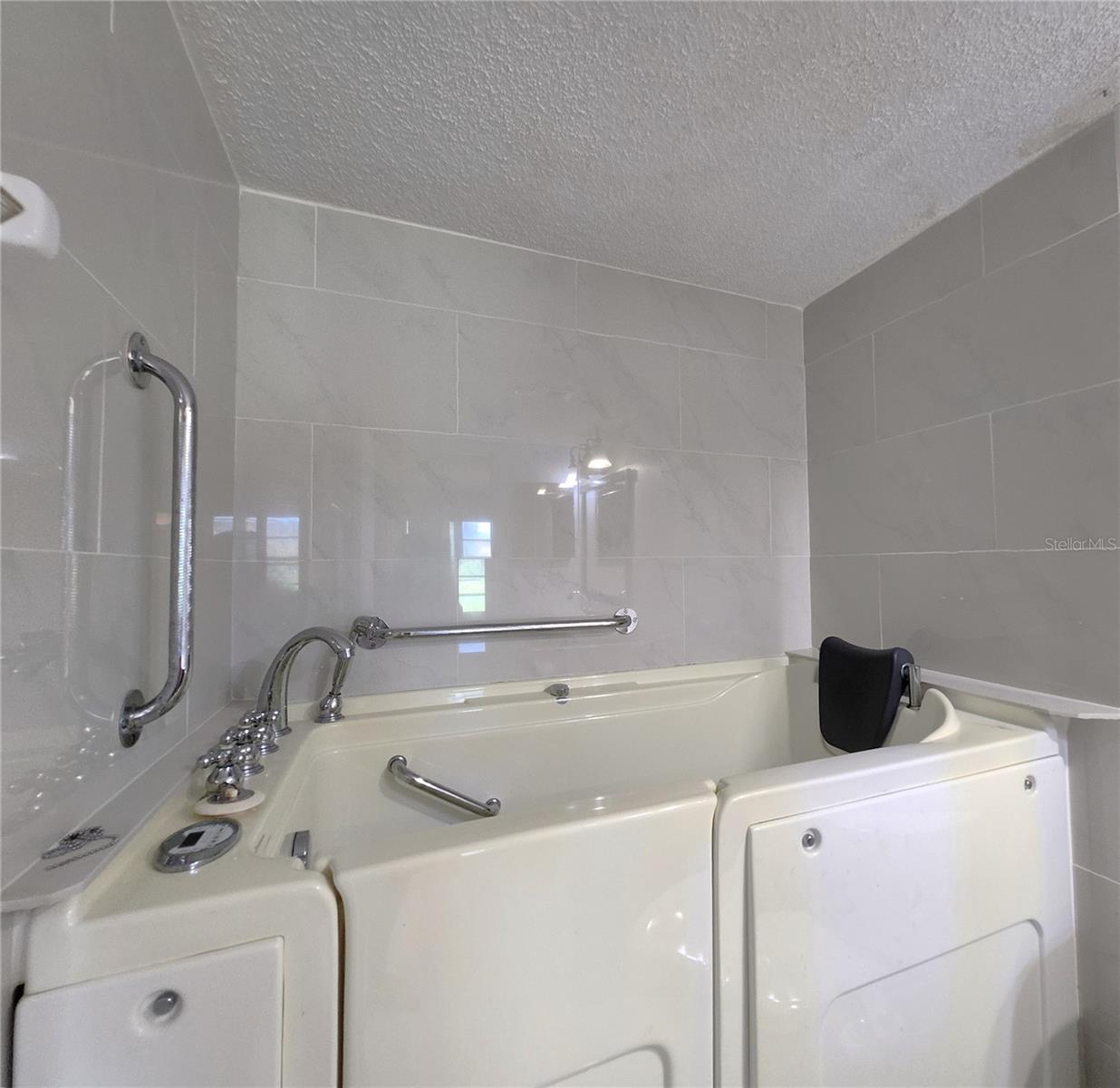 Master Bathroom includes Walk-In Whirlpool Bathtub w/Jets & built-in Seat