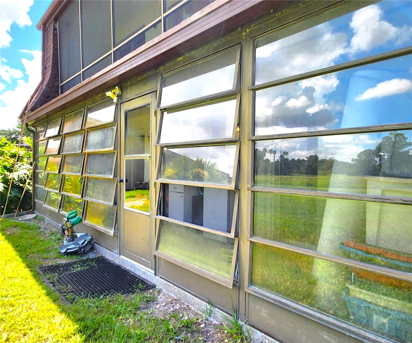 Florida Room is the same width as the Condo - wall to wall. It includes 2 ample Storage Closets, Jalousie Windows, access to the community backyard