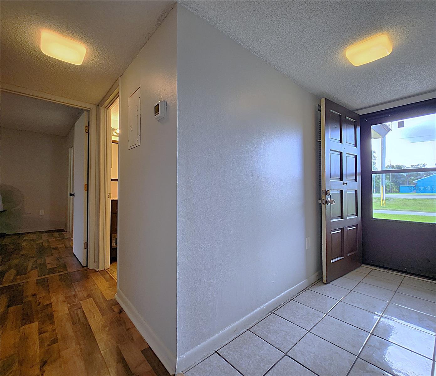 Foyer with Ceramic Tile; Hallway with laminate flooring,