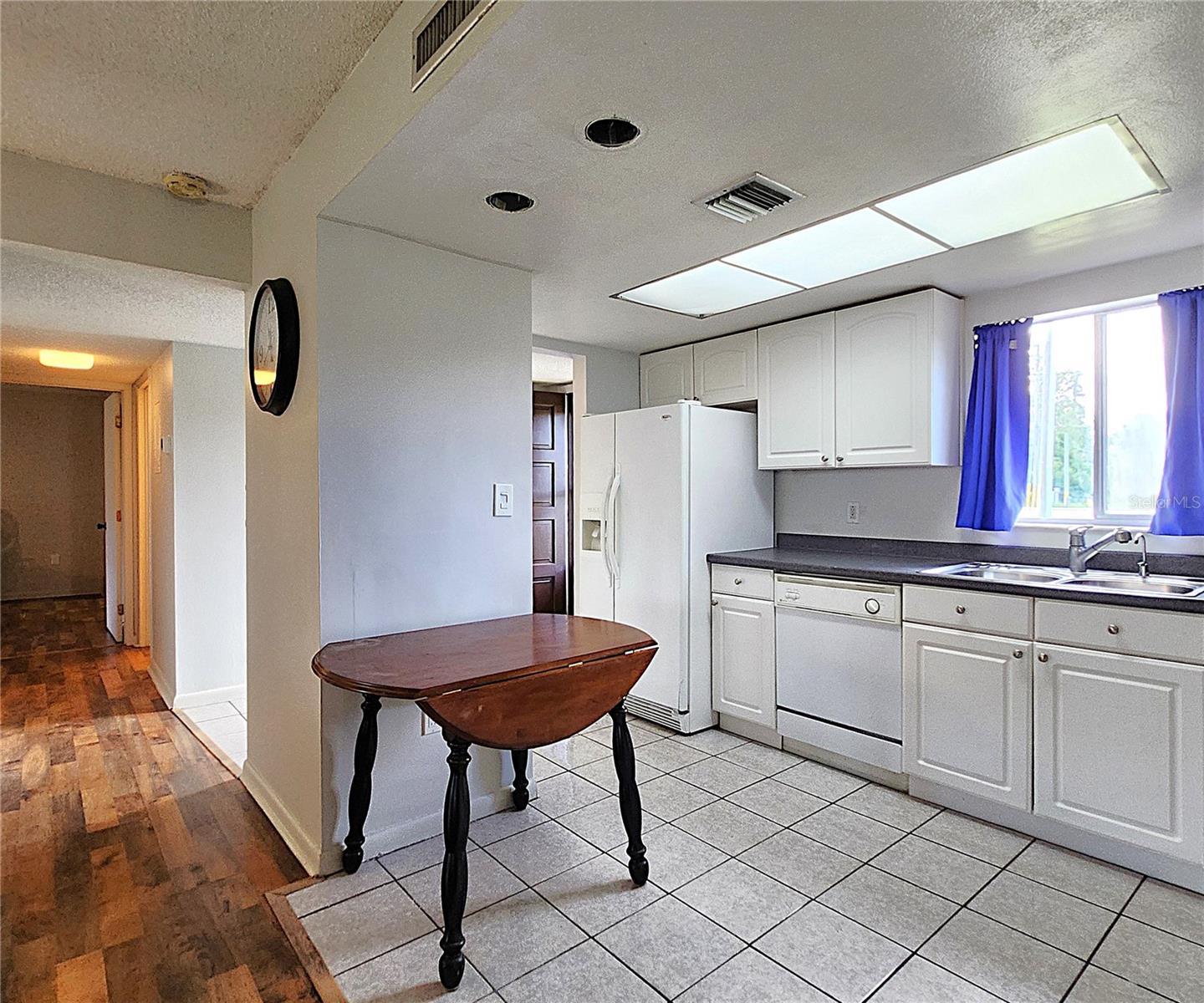 All kitchen appliances included: hooded vent, electric stove, dishwasher, refrigerator