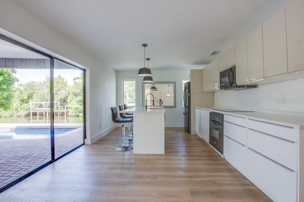 Kitchen offers sliders leading to the pool.